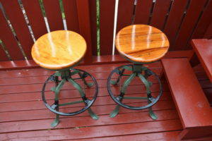 Old metal and wood stools preserved with linseed oil products.