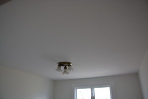(After) Stucco removed, ceiling skimmed smooth with plaster and painted.
