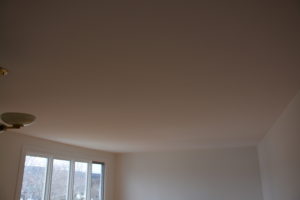 (After) Stucco ceiling sanded and skimmed smooth with plaster and painted